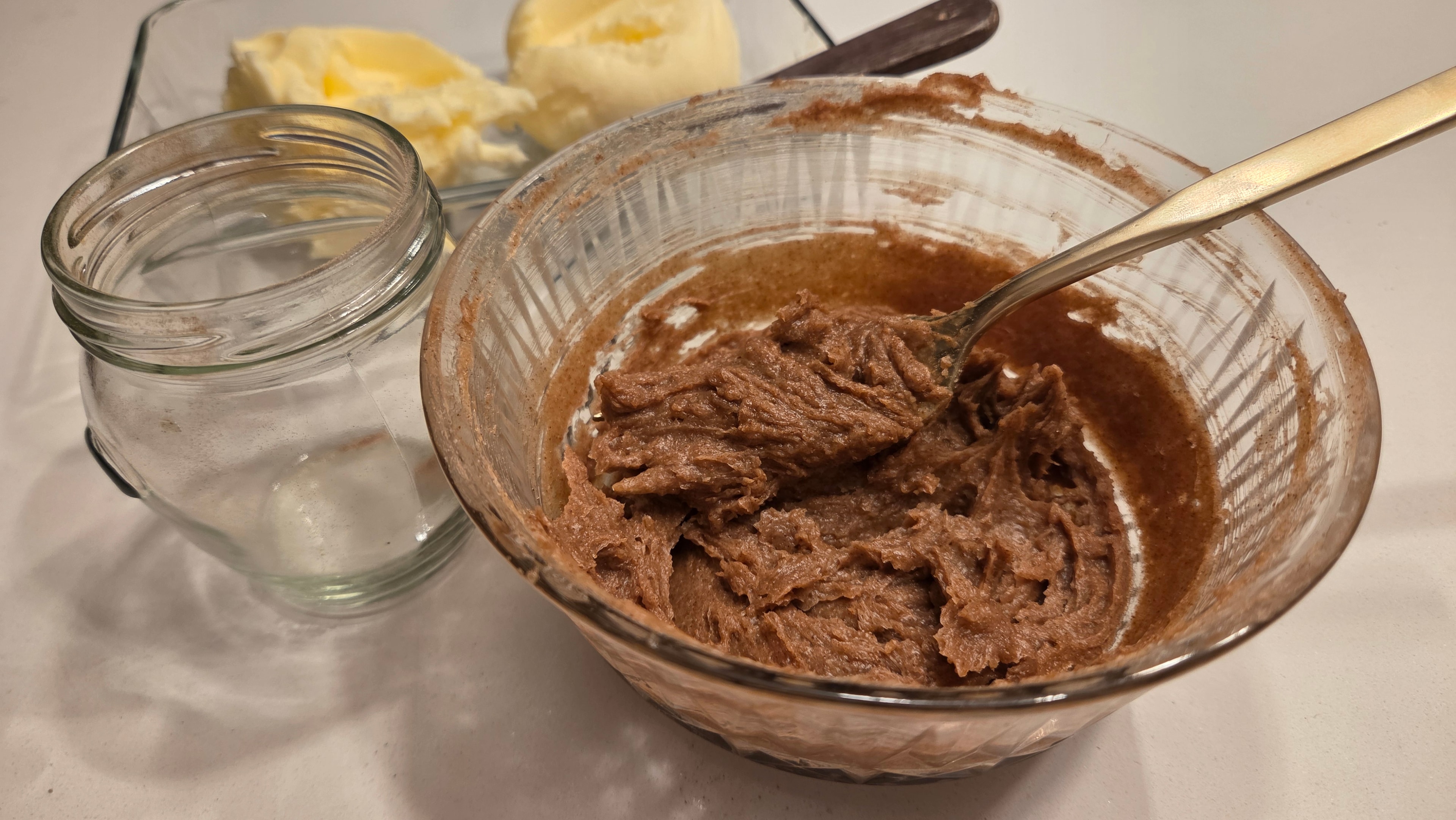 Finished cinnamon butter mixed in a glass bowl — rich, dark, and fragrant with cinnamon