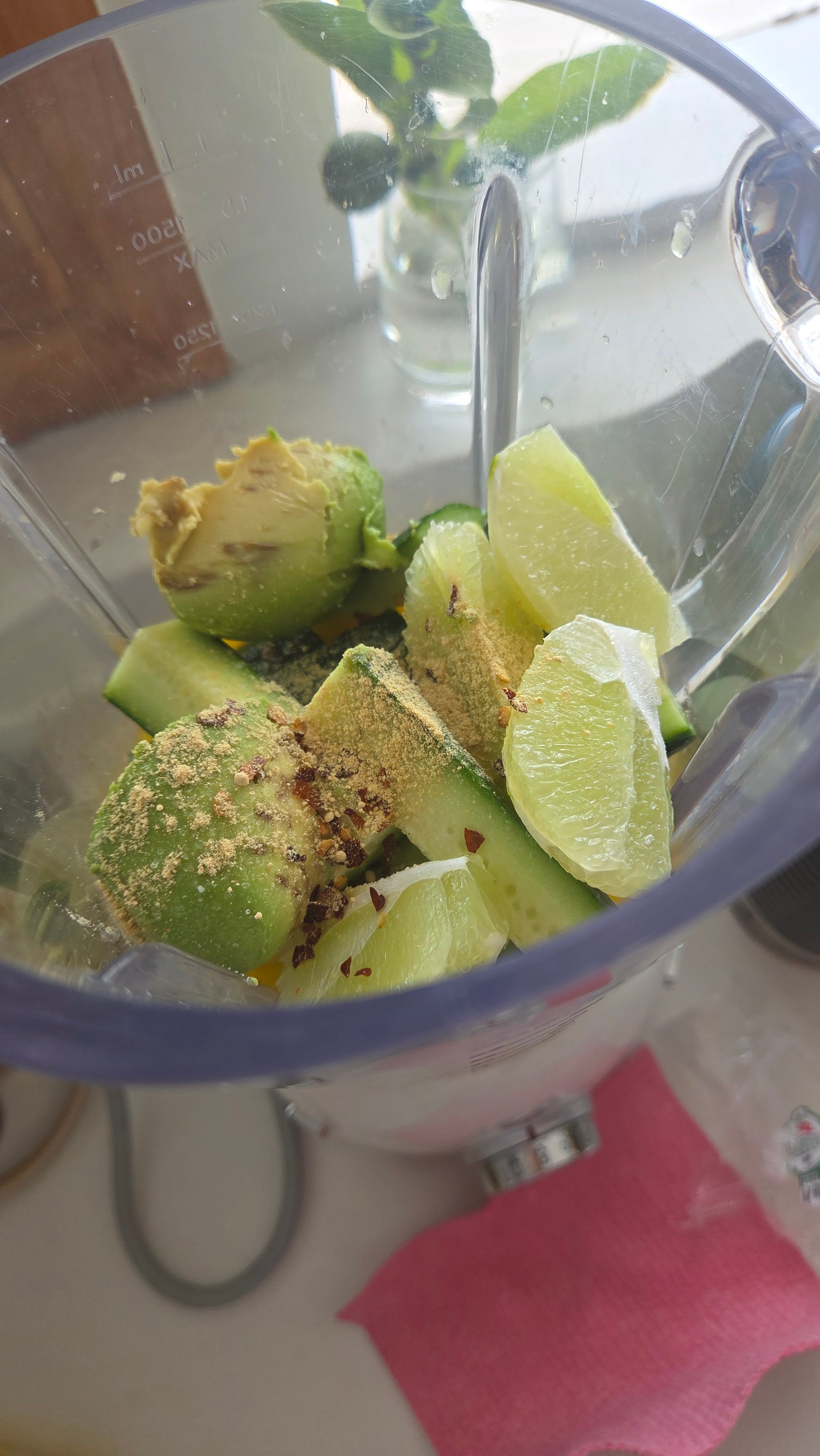 Cool Green Smoothie close-up showing the creamy avocado texture with cucumber garnish